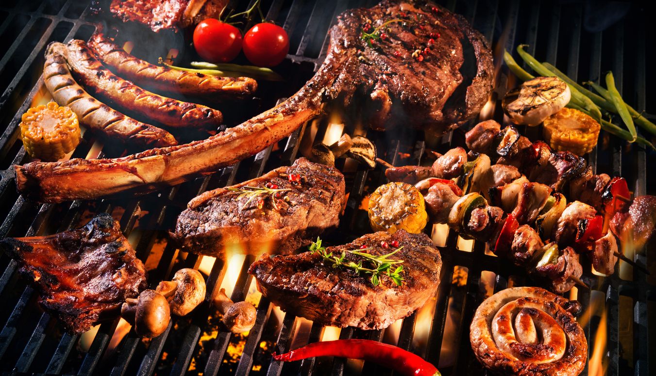 Family making barbecue in dinner party camping at night