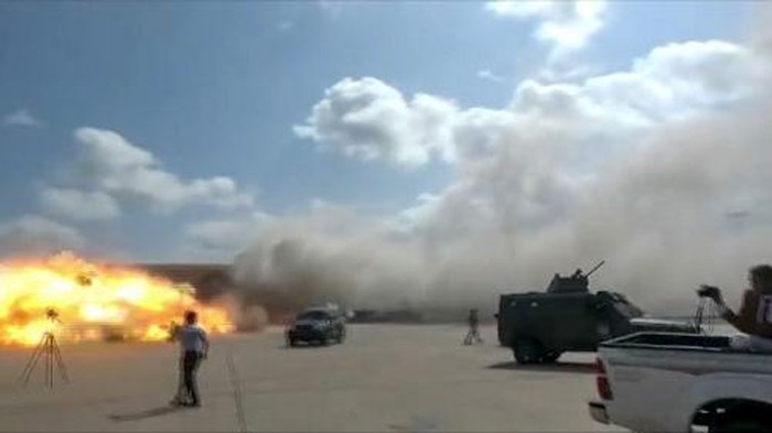 A video grab shows the moment an ordnance hit the airport in the southern Yemeni port city of Aden on December 30, 2020, shortly after the arrival of a plane carrying members of a new unity government. - Explosions rocked Yemens Aden airport on Wednesday shortly after the arrival of a plane carrying members of a new unity government, an AFP correspondent at the scene said. 