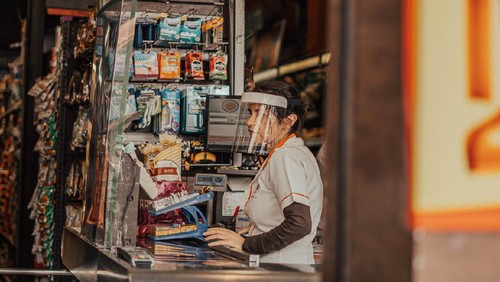 supermarket cashier wearing mask on a supermarket on Aclimação neighborhood in São Paulo city during coronavirus quarantine.