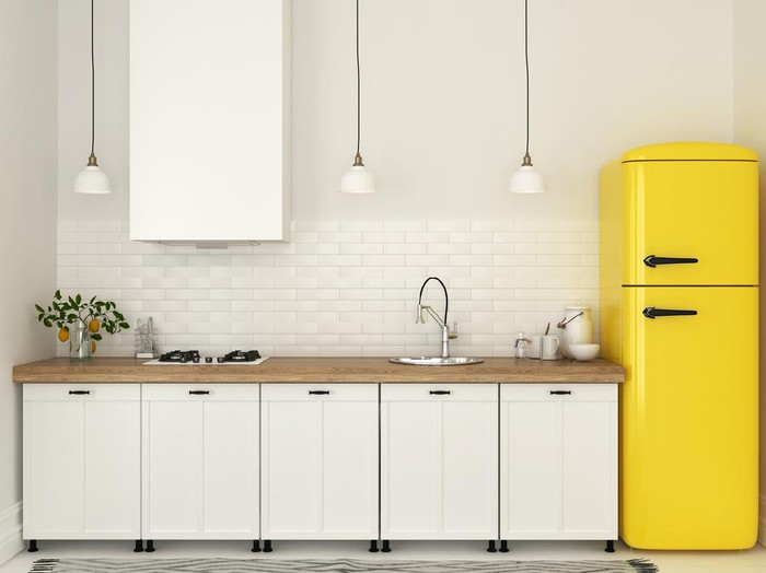 desain dapur minimalis Bright kitchen with white furniture and a bright yellow fridge