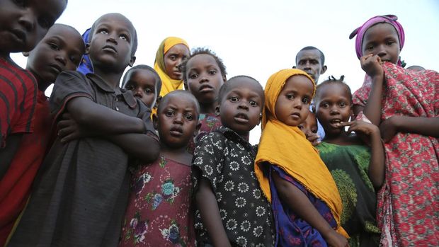 Internally displaced people gather in Daynile camp in Mogadishu, Somalia on Thursday Dec. 17, 2020. As richer countries race to distribute COVID-19 vaccines, Somalia remains the rare place where much of the population hasn't taken the coronavirus seriously. Some fear that’s proven to be deadlier than anyone knows. (AP Photo/Farah Abdi Warsameh)