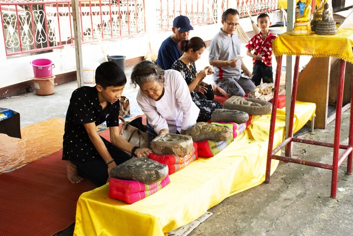 Thai people and foreign traveler respect pray and rite ritual god angel buddha statue at Wat Phra That Phanom temple on October 2, 2019 in Nakhon Phanom, Thailand