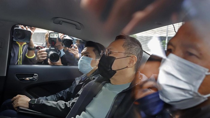 Former law professor Benny Tai, center, a key figure in Hong Kongs 2014 Occupy Central protests and also was one of the main organizers of the primaries, sits in a car after being arrested by police in Hong Kong, Wednesday, Jan. 6, 2021. About 50 Hong Kong pro-democracy figures were arrested by police on Wednesday under a national security law, following their involvement in an unofficial primary election last year held to increase their chances of controlling the legislature, according to local media reports. (AP Photo/Apple Daily)