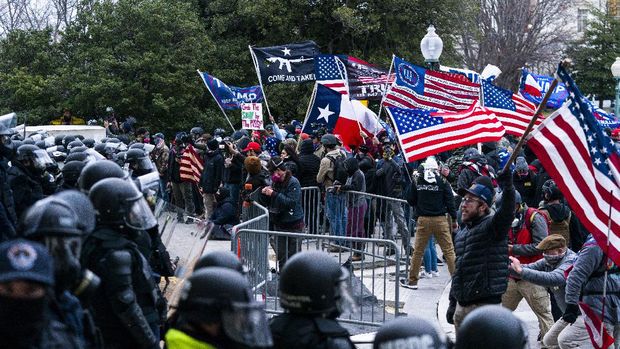 Electoral College Protests Supporters of President Donald Trump are confronted by U.S. Capitol Police officers outside the Capitol, Wednesday, Jan. 6, 2021 in Washington. (AP Photo/Manuel Balce Ceneta)