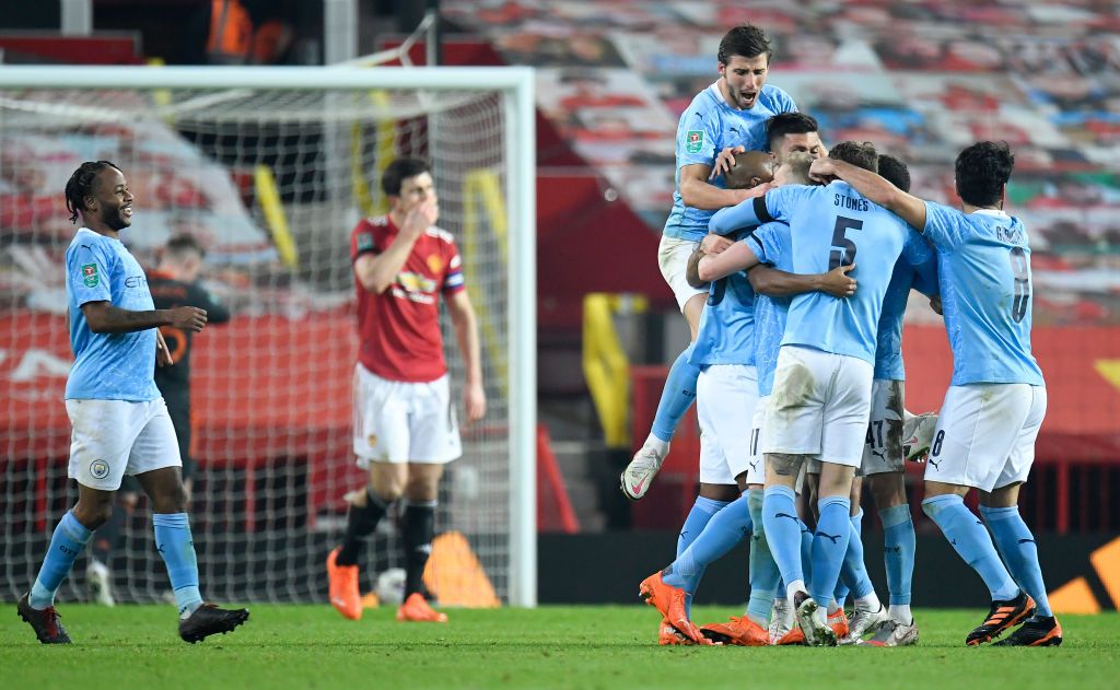 MANCHESTER, ENGLAND - JANUARY 06: Fernandinho of Manchester City celebrates after scoring his teams second goal with his team mates during the Carabao Cup Semi Final match between Manchester United and Manchester City at Old Trafford on January 06, 2021 in Manchester, England. The match will be played without fans, behind closed doors as a Covid-19 precaution. (Photo by Peter Powell - Pool/Getty Images)