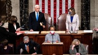 Hasil akhir perolehan Electoral College dalam pilpres AS 2020 diumumkan secara resmi oleh Wakil Presiden Mike Pence yang menjalankan tugasnya memimpin sidang ini. Pukul 03.40 waktu setempat, Pence mengumumkan Biden sebagai pemenang pilpres AS dengan meraup 306 electoral votes atas Trump dengan 232 electoral votes. Photo by Erin Schaff / POOL / AFP  