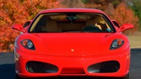 Ferrari Trump berwarna Corsa Red dengan interior kulit krem. Ferrari ini tentunya juga disertai dengan tanda tangan Trump dan bukti sertifikat kepemilikannya. Foto: Mecum Kisimme