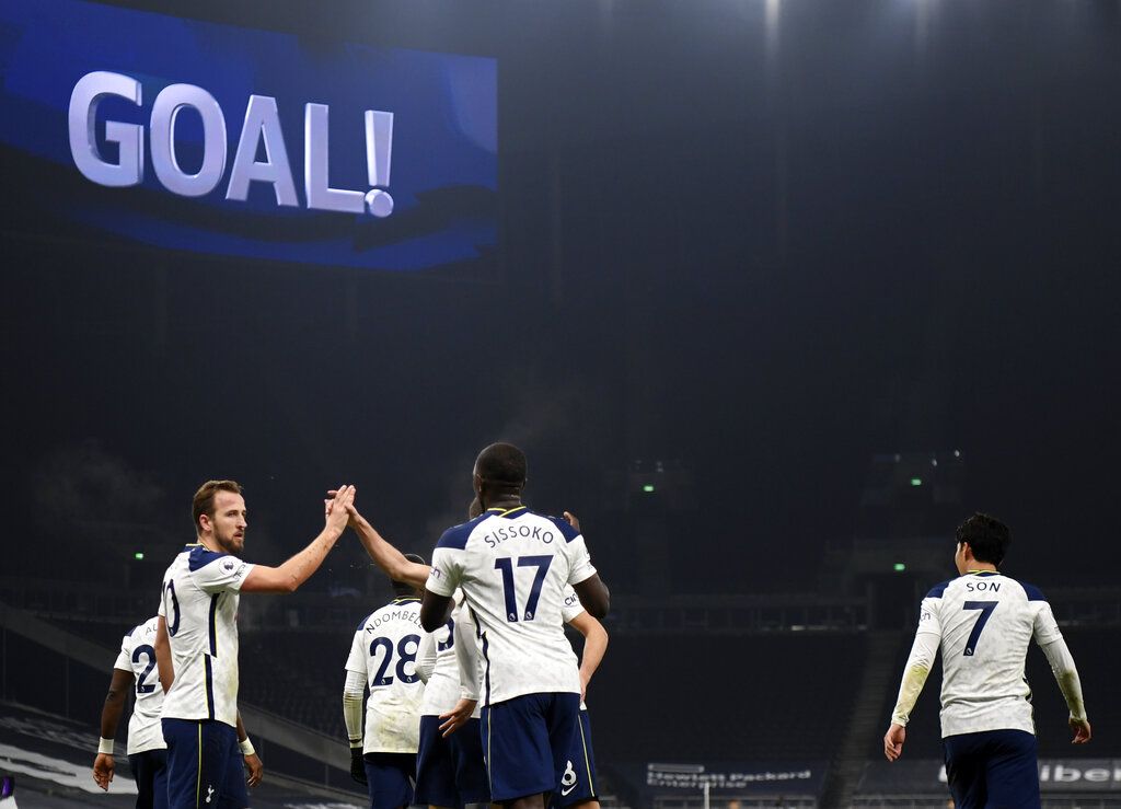 Harry Kane Tottenham's Harry Kane, left, celebrates with teammates after scoring his side's opening goal during the English Premier League soccer match between Tottenham Hotspur and Fulham at the Tottenham Hotspur Stadium in London, Wednesday, Jan. 13, 2021. (Shaun Botterill/Pool via AP)