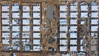 Situasi itu mengingatkan pada momen tahun lalu saat China melakukan pembangunan rumah sakit darurat secara kilat dan mengubah gelanggang olahraga menjadi pusat-pusat isolasi untuk pasien Corona, saat kasus di negara itu memuncak. AP Photo/Yang Shiyao  