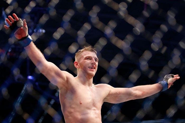 MELBOURNE, AUSTRALIA - OCTOBER 06: Dan Hooker of New Zealand celebrates his victory over Al Iaquinta of the United States fight in their Lightweight bout during UFC 243 at Marvel Stadium on October 06, 2019 in Melbourne, Australia. (Photo by Darrian Traynor/Getty Images)