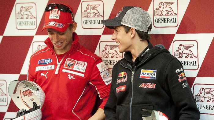 VALENCIA, SPAIN - NOVEMBER 06: Casey Stoner of Australia and Ducati Marlboro Team (L) and  Marc Marquez of Spain and Red Bull AJo Motorsport pose during the press conference after the qualifying practice of MotoGP of Valencia at Ricardo Tormo Circuit on November 6, 2010 in Valencia, Spain.  (Photo by Mirco Lazzari gp/Getty Images)