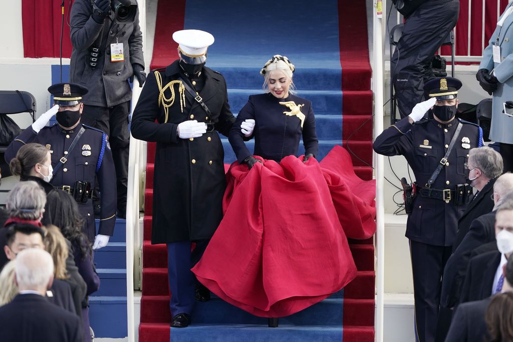 Lady Gaga performs the National Anthem as President-elect Joe Biden applauds during the 59th Presidential Inauguration at the U.S. Capitol in Washington, Wednesday, Jan. 20, 2021. (AP Photo/Andrew Harnik)