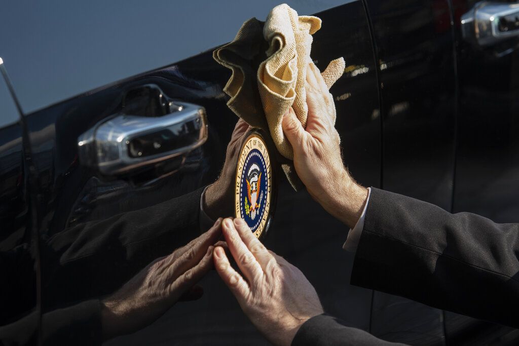 President Joe Biden waves as he rides in the presidential limousine following his inauguration, Wednesday, Jan. 20, 2021, at the U.S. Capitol in Washington.(Rod Lamkey/Pool Photo via AP)
