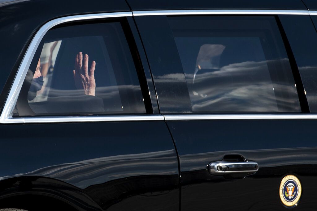 President Joe Biden waves as he rides in the presidential limousine following his inauguration, Wednesday, Jan. 20, 2021, at the U.S. Capitol in Washington.(Rod Lamkey/Pool Photo via AP)