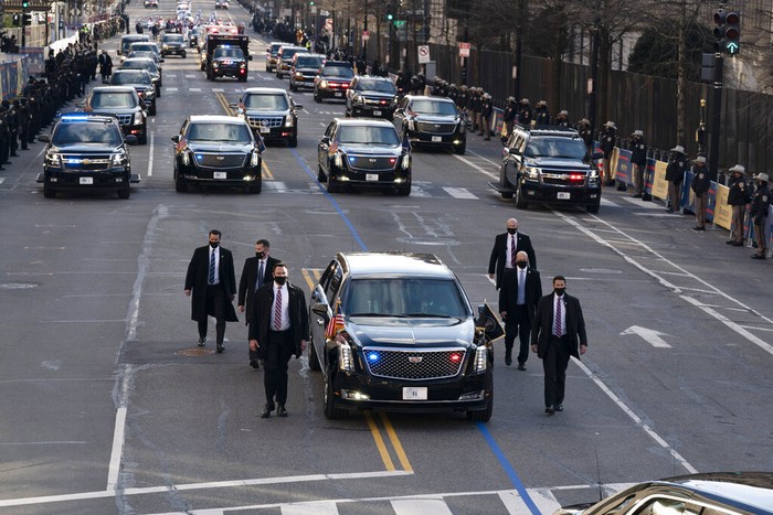President Joe Biden and first lady Jill Biden, walk near the White House during a Presidential Escort to the White House, Wednesday, Jan. 20, 2021 in Washington. (AP Photo/Jose Luis Magana)