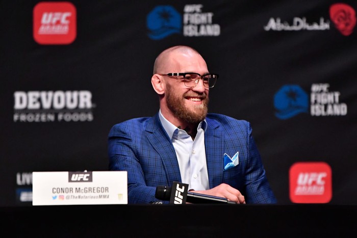 ABU DHABI, UNITED ARAB EMIRATES - JANUARY 21:  In this handout image provided by the UFC, Conor McGregor of Ireland interacts with media during the UFC 257 press conference event inside Etihad Arena on UFC Fight Island on January 21, 2021 in Yas Island, Abu Dhabi, United Arab Emirates. (Photo by Jeff Bottari/Zuffa LLC via Getty Images)