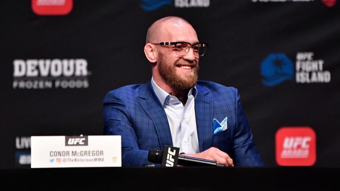 ABU DHABI, UNITED ARAB EMIRATES - JANUARY 21:  In this handout image provided by the UFC, Conor McGregor of Ireland interacts with media during the UFC 257 press conference event inside Etihad Arena on UFC Fight Island on January 21, 2021 in Yas Island, Abu Dhabi, United Arab Emirates. (Photo by Jeff Bottari/Zuffa LLC via Getty Images)