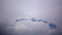 Gunung Raung tertutup awan terlihat dari Desa Garahan, Silo, Jember, Jawa Timur, Kamis (21/1/2021). 