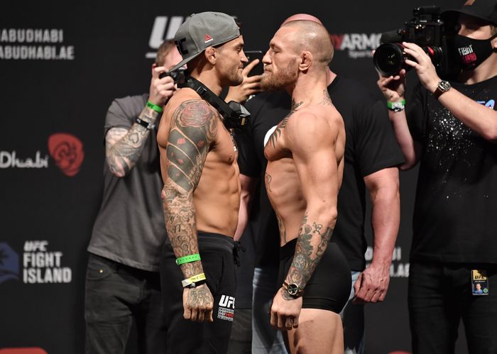 dustin poirier conor mcgregor ufc 257 ufc ABU DHABI, UNITED ARAB EMIRATES - JANUARY 22: In this handout image provided by the UFC, (L-R) Opponents Dustin Poirier and Conor McGregor of Ireland face off during the UFC 257 weigh-in at Etihad Arena on UFC Fight Island on January 22, 2021 in Abu Dhabi, United Arab Emirates. (Photo by Jeff Bottari/Zuffa LLC via Getty Images)