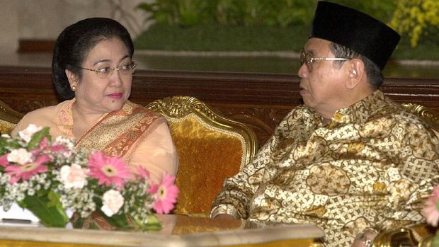 Indonesian Vice President Megawati Sukarnoputri, left, looks towards President Abdurrahman Wahid during a ceremony at the presidential palace in Jakarta Wednesday, May 2, 2001. Wahid and Megawati were seen together in public for the first time since the embattled president's second censure for corruption by parliament, paving the way for his possible impeachment. (AP Photo/Muchtar Zakaria)