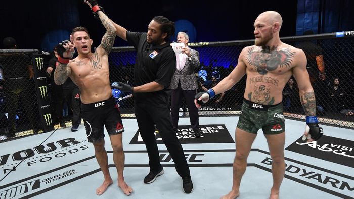 ABU DHABI, UNITED ARAB EMIRATES - JANUARY 23: In this handout image provided by the UFC, Dustin Poirier reacts after his knockout victory over Conor McGregor of Ireland in a lightweight fight during the UFC 257 event inside Etihad Arena on UFC Fight Island on January 23, 2021 in Abu Dhabi, United Arab Emirates. (Photo by Jeff Bottari/Zuffa LLC via Getty Images)