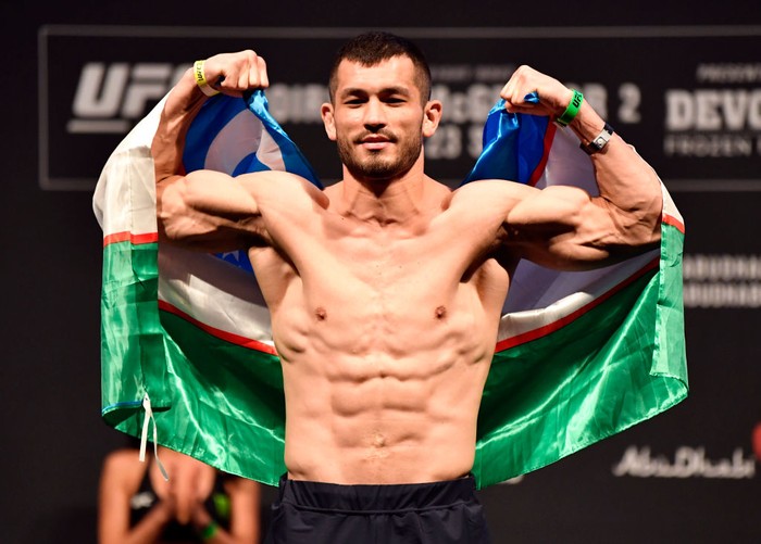 ABU DHABI, UNITED ARAB EMIRATES - JANUARY 22:  In this handout image provided by the UFC, Makhmud Muradov of Uzbekistan poses on the scale during the UFC 257 weigh-in at Etihad Arena on UFC Fight Island on January 22, 2021 in Abu Dhabi, United Arab Emirates. (Photo by Jeff Bottari/Zuffa LLC via Getty Images)