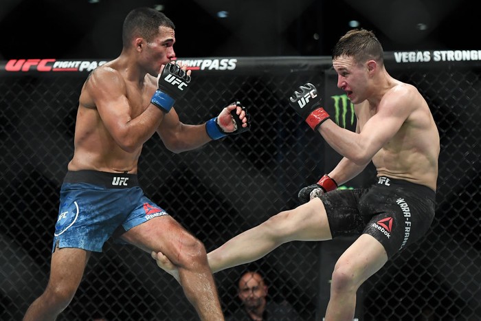 SHENZHEN, CHINA - AUGUST 31:  (R-L) Kai Kara-France of New Zealand kicks Mark De La Rosa in their flyweight bout during the UFC Fight Night event at Shenzhen Universiade Sports Centre on August 31, 2019 in Shenzhen, China.  (Photo by Zhe Ji/Getty Images)