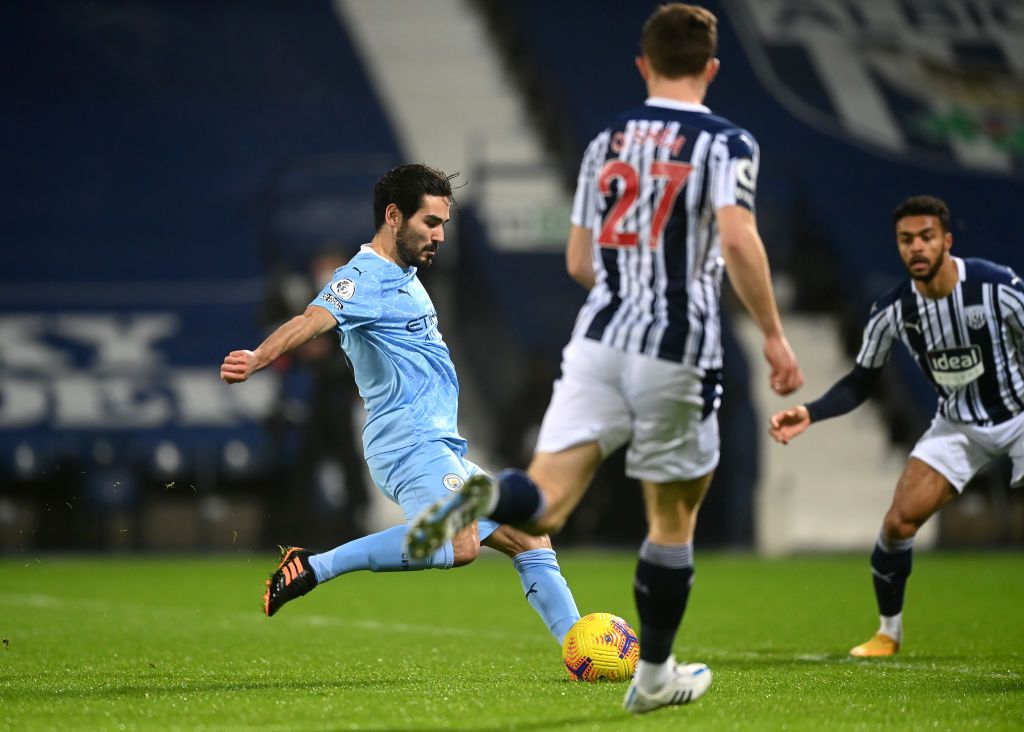 Ilkay Guendogan WEST BROMWICH, ENGLAND - JANUARY 26: Ilkay Guendogan of Manchester City celebrates after scoring their team's firs goal during the Premier League match between West Bromwich Albion and Manchester City at The Hawthorns on January 26, 2021 in West Bromwich, England. Sporting stadiums around the UK remain under strict restrictions due to the Coronavirus Pandemic as Government social distancing laws prohibit fans inside venues resulting in games being played behind closed doors. (Photo by Nick Potts - Pool/Getty Images)