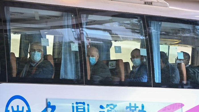 Members of the World Health Organization (WHO) team investigating the origins of the Covid-19 coronavirus pandemic leave The Jade Hotel on a bus after completing their quarantine in Wuhan, Chinas central Hubei province on January 28, 2021. (Photo by Hector RETAMAL / AFP) (Photo by HECTOR RETAMAL/AFP via Getty Images)