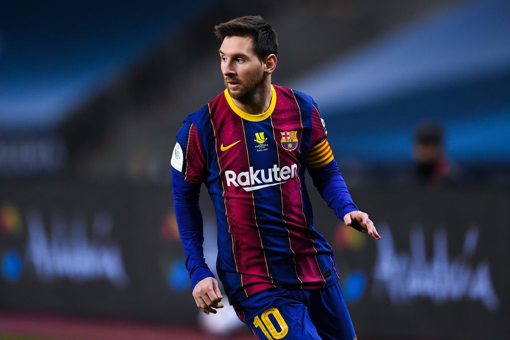 Messi SEVILLE, SPAIN - JANUARY 17: Lionel Messi of FC Barcelona looks on during the Supercopa de Espana Final match between FC Barcelona and Athletic Club at Estadio de La Cartuja on January 17, 2021 in Seville, Spain. Sporting stadiums around Spain remain under strict restrictions due to the Coronavirus Pandemic as Government social distancing laws prohibit fans inside venues resulting in games being played behind closed doors. (Photo by David Ramos/Getty Images)