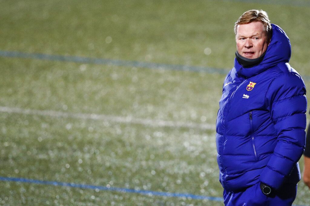 Barcelona's head coach Ronald Koeman during a Spanish Copa del Rey round of 32 soccer match between Cornella and FC Barcelona at the Nou Municipal stadium in Cornella, Spain, Thursday, Jan. 21, 2021. (AP Photo/Joan Monfort)