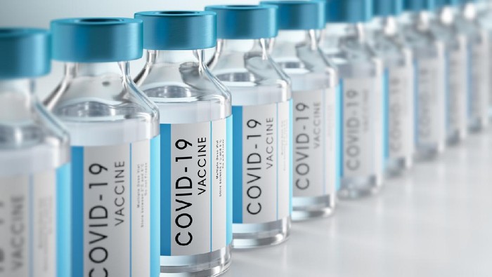 Vaksin Covid-19 Row Covid-19 or Coronavirus vaccine flasks on white background