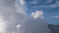 Asap dari pusat Bromo yang mewarnai langit biru