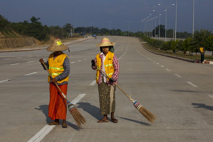 NAYPYITAW, MYANMAR - DECEMBER 6 :  Street sweepers keep the wide streets clean December 6, 2011 in Nay Pyi Taw, Myanmar. NayPyiTaw is the capitol city of Myanmar, formally in Yangon until the Burmese government created a new secluded capitol closed off from much of the world until recently. The pace of change in Myanmar brought U.S Secretary of State Hillary Clinton to the country where she discussed further paths to reform and crucial talks with both Aung San Suu Kyi and the highest levels of the Burmese government. For many years Myanmar has suffered from economic stagnation, political repression and international isolation. In March the army handed power to a civilian government after almost five decades of the military regimes strong arm rule. The handover took place after a controlled election under a new constitution that preserved much of the military clout.  Internet has been loosened up as previously inaccessible foreign news and opposition websites have been unblocked. 
(Photo by Paula Bronstein/Getty Images)