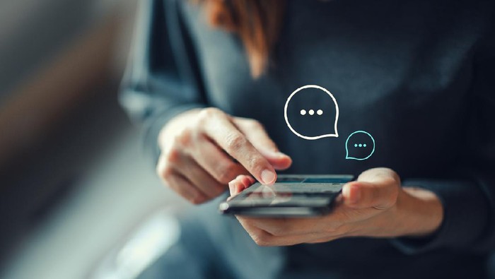 Womens hand typing on mobile smartphone, Live Chat Chatting on application Communication Digital Web and social network Concept. Work from home.