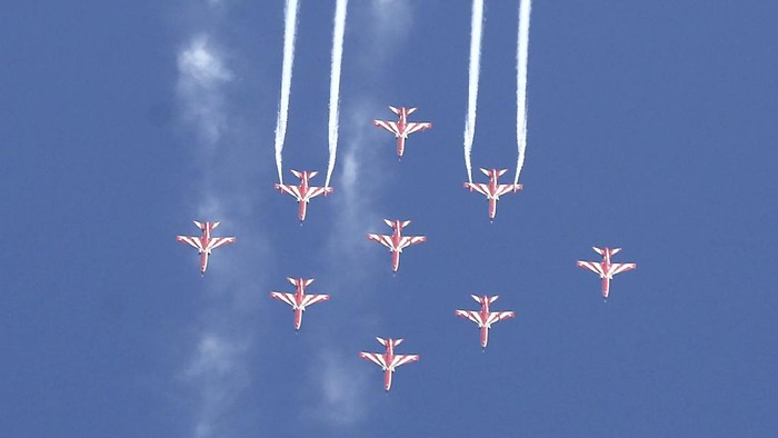 Indian Air Force Suryakiran aircraft perform aerobatic maneuvers on the second day of Aero India 2021 at Yelahanka air base in Bengaluru, India, Thursday, Feb. 4, 2021. Aero India is a biennial event with flying demonstrations by stunt teams and militaries and commercial pavilions where aviation companies display their products and technology. (AP Photo/Aijaz Rahi)