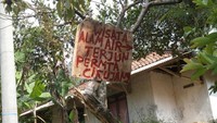 Plang Pintu Masuk