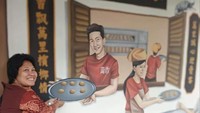 Replika pedagang kue tradisopnal di salah satu kedai di Lebuh Campbell.