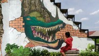 Mural kepala buaya di salah satu dinding bekas gudang Baba Boentjit.