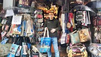He is the owner of the shop, we can call him