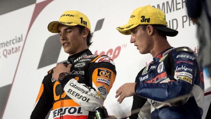 DOHA, QATAR - APRIL 08:  Marc Marquez of Spain and Team Catalunya Caixa Repsol and Pol Espargaro of Spain and Pons 40 HP Tuenti (R) celebrate on the podium at the end of the Moto2 race of MotoGP of Qatar at Losail Circuit on April 8, 2012 in Doha, Qatar.  (Photo by Mirco Lazzari gp/Getty Images)