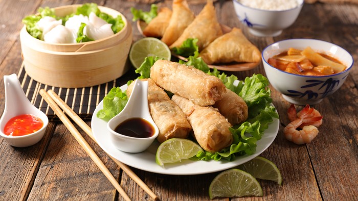 assorted of asian food- spring roll, noodles soup, dim sum