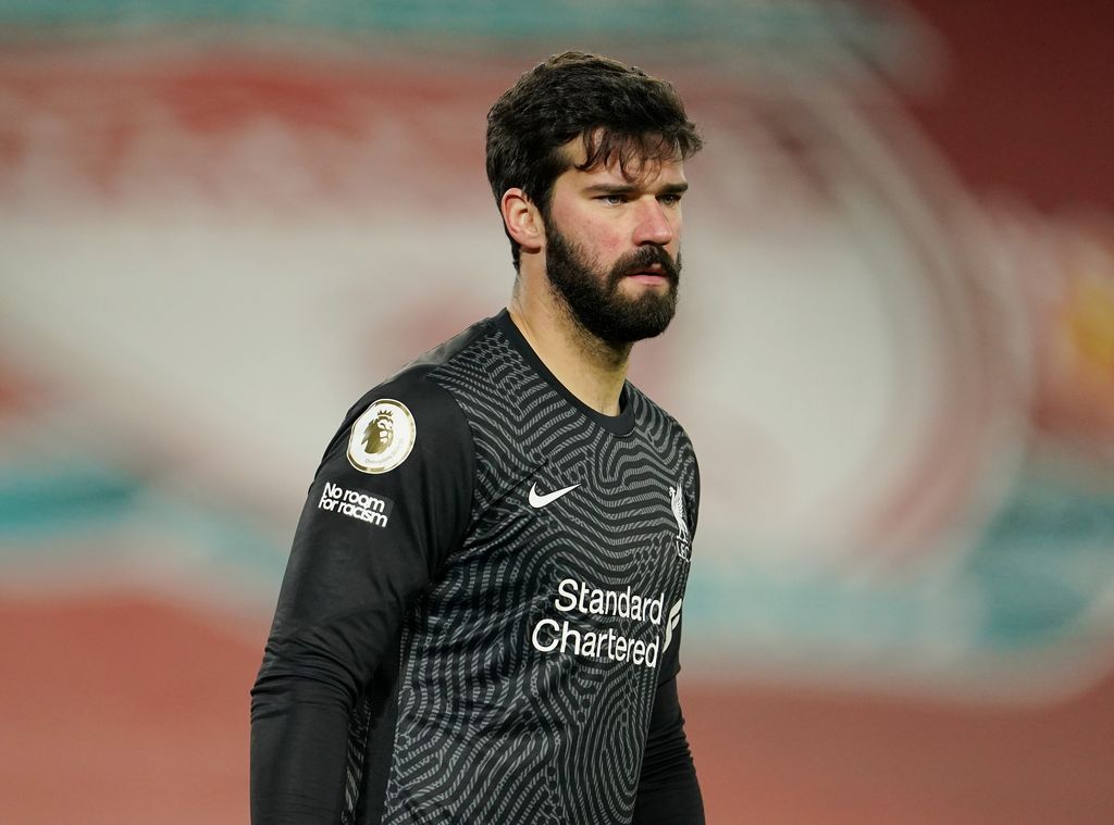 Alisson Becker LIVERPOOL, ENGLAND - FEBRUARY 07: Alisson Becker of Liverpool looks on during the Premier League match between Liverpool and Manchester City at Anfield on February 07, 2021 in Liverpool, England. Sporting stadiums around the UK remain under strict restrictions due to the Coronavirus Pandemic as Government social distancing laws prohibit fans inside venues resulting in games being played behind closed doors (Photo by Jon Super - Pool/Getty Images)