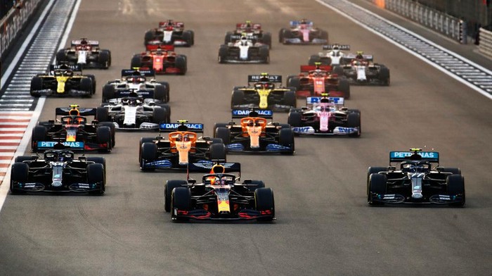 ABU DHABI, UNITED ARAB EMIRATES - DECEMBER 13: Max Verstappen of the Netherlands driving the (33) Aston Martin Red Bull Racing RB16 leads Lewis Hamilton of Great Britain driving the (44) Mercedes AMG Petronas F1 Team Mercedes W11 and Valtteri Bottas of Finland driving the (77) Mercedes AMG Petronas F1 Team Mercedes W11 into turn one at the start during the F1 Grand Prix of Abu Dhabi at Yas Marina Circuit on December 13, 2020 in Abu Dhabi, United Arab Emirates. (Photo by Hamad I Mohammed - Pool/Getty Images)