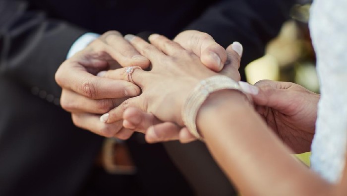 Cropped shot of a couple exchanging rings on their wedding day