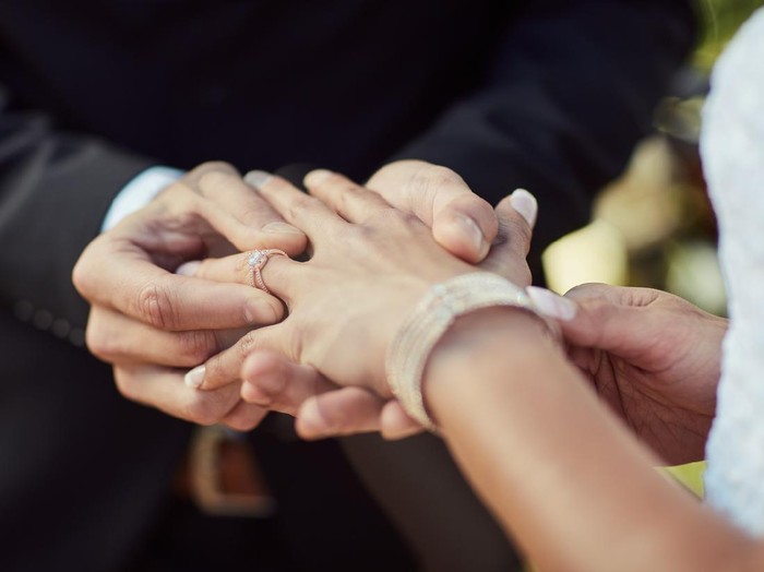 Cropped shot of a couple exchanging rings on their wedding day