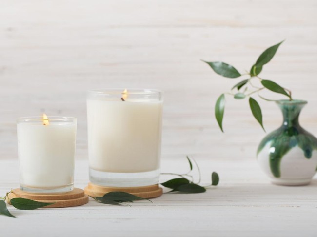 scented candles on white background