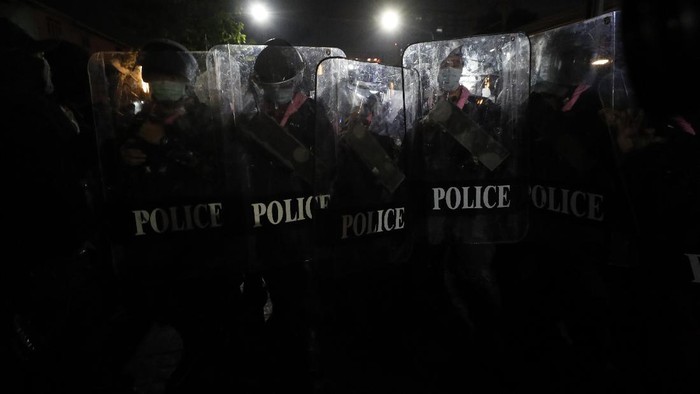 Hundreds of pro-democracy protesters march demanding the release of pro-democracy activists in Bangkok, Thailand, Wednesday, Feb. 10, 2021. Protesters demanded the government to step down, the constitution to be amended to make it more democratic and the monarchy be more accountable. (AP Photo/Sakchai Lalit)