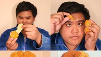 Rambut anime ini berwarna oranye dan ditata seperti bertumpuk. Anucha coba mewujudkannya dengan kumpulan jeruk Mandarin. Foto: Instagram lowcostcosplayth