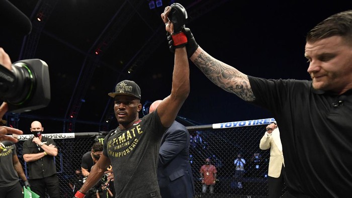 ABU DHABI, UNITED ARAB EMIRATES - JULY 12: In this handout image provided by UFC, Kamaru Usman of Nigeria celebrates after his victory over Jorge Masvidal in their UFC welterweight championship fight during the UFC 251 event at Flash Forum on UFC Fight Island on July 12, 2020 on Yas Island, Abu Dhabi, United Arab Emirates. (Photo by Jeff Bottari/Zuffa LLC via Getty Images)